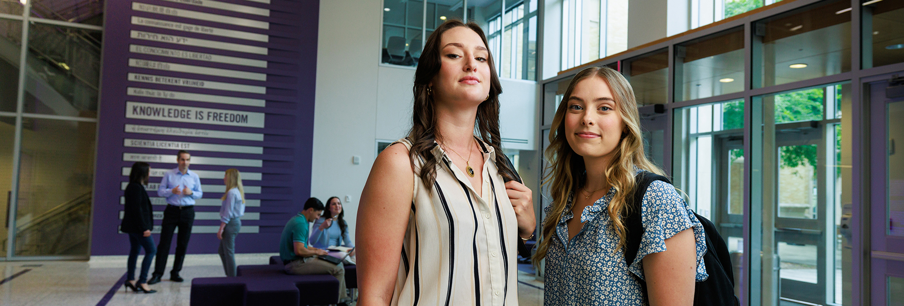 Section Image: Two female students in the Rees-Jones lobby 