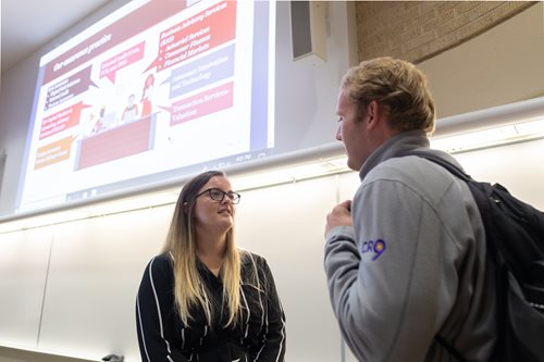 Students talking in a classroom