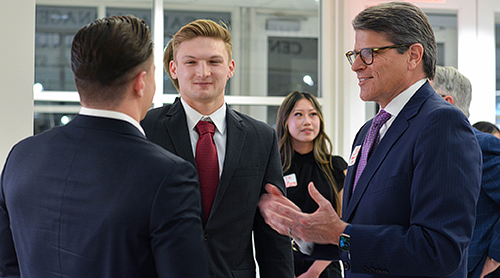Students enteracting with business leaders at the Career Fair.