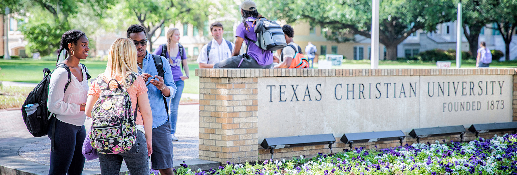 Section Image: diverse students at the TCU sign 