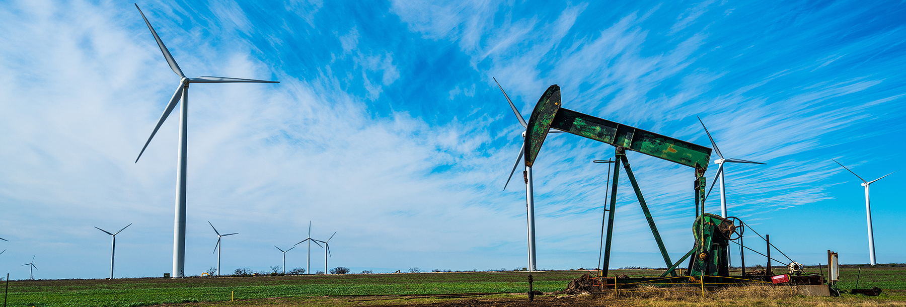 Section Image: windmills and oil derrick 