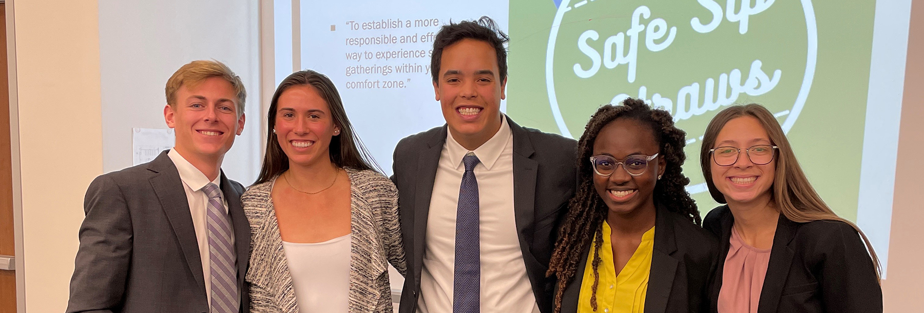 Section Image: Neeley Fellows in front of their Safe Sip presentation 