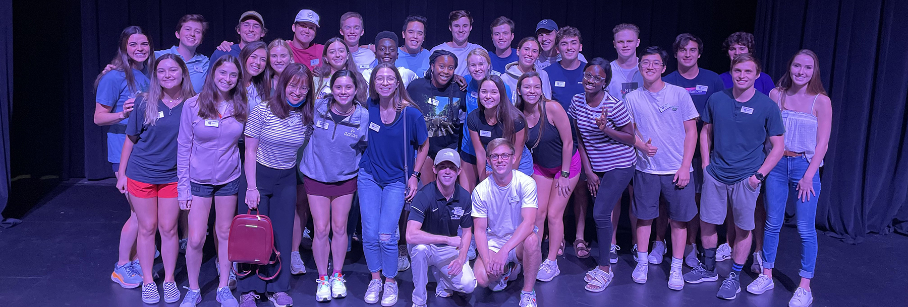 Section Image: Neeley Fellows on a stage 