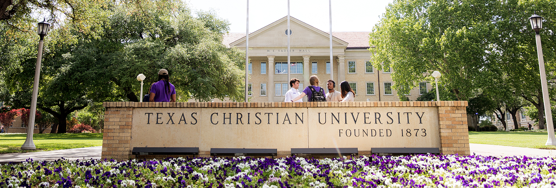 Section Image: TCU sign with students 