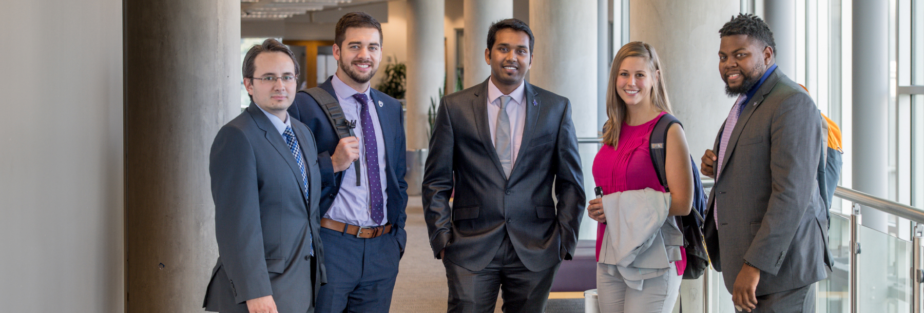 Section Image: Neeley students in suits in Smith Hall 