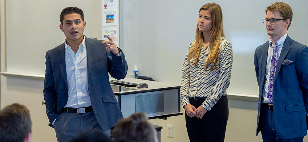 Section Image: Sales team presenting in class. 