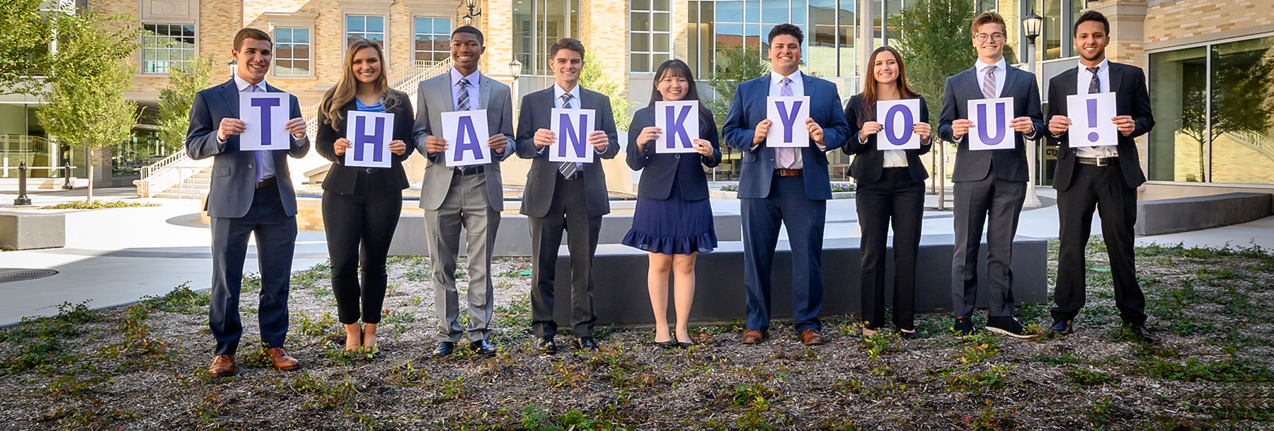 Section Image: Students with signs spelling thank you 