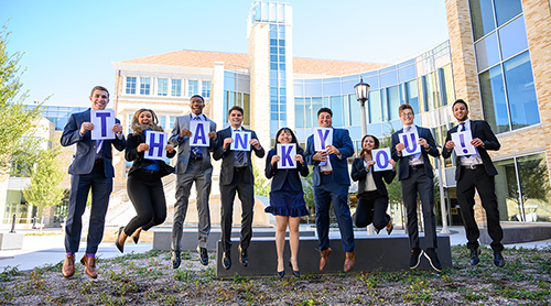 Section Image: Students with signs spelling thank you 