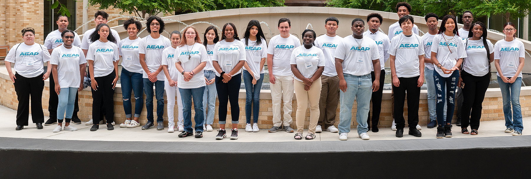 Section Image: Students in ACAP tshirts by fountain 