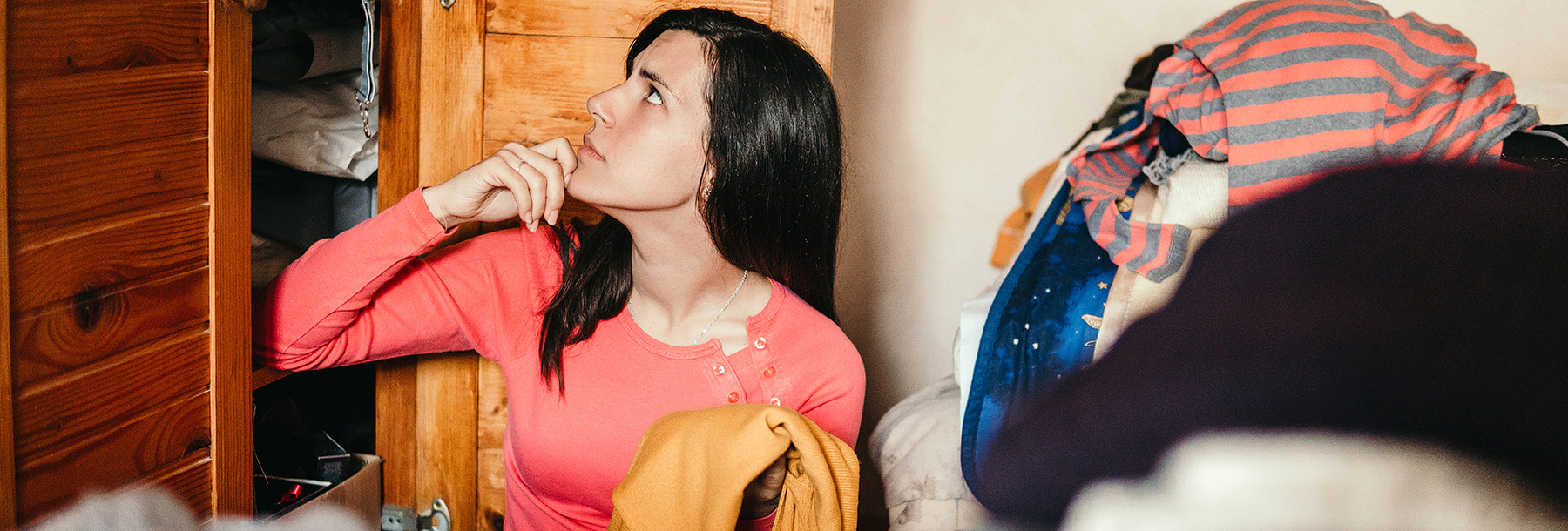 Section Image: Woman sorting clothes 