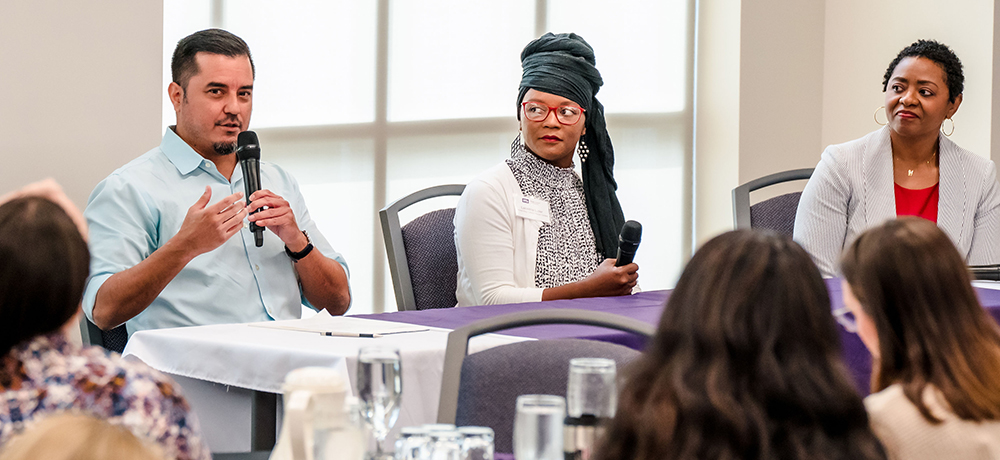 Students in a panel speaking.