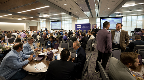 Section Image: Ann Bluntzer, Jonathan Benjamin-Alvarado, Manochehr Dorraj and Kenneth Wagner, the moderators and hosts of the event, address the crowd. 