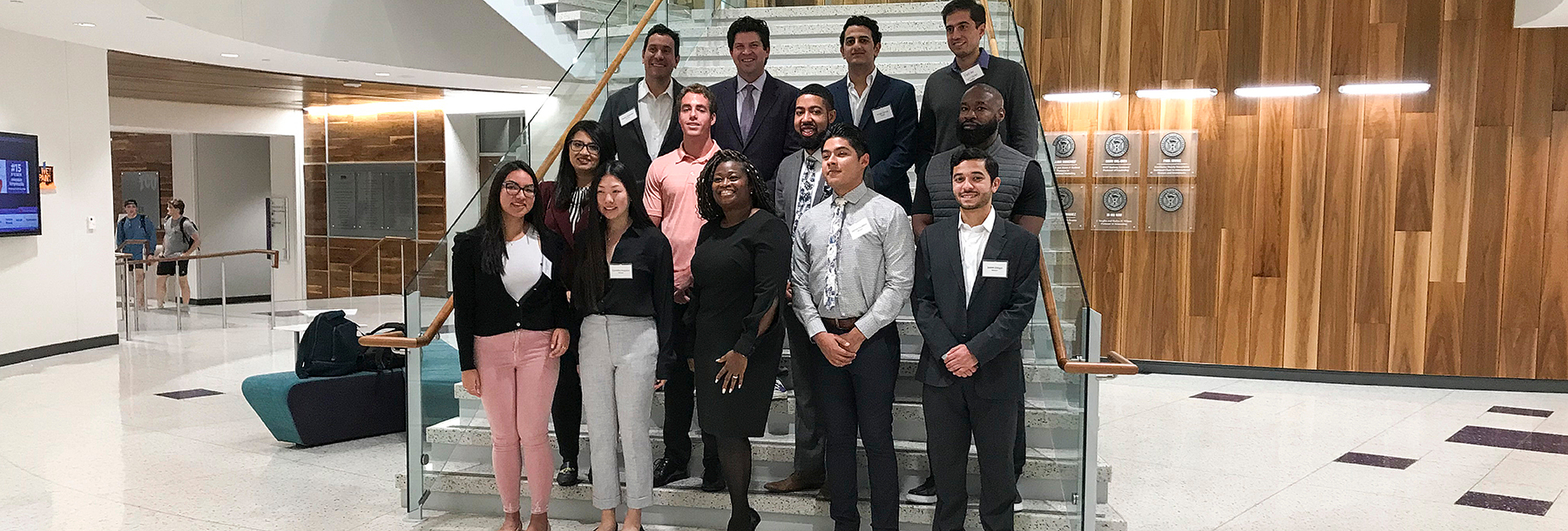 Section Image: Mentors, Mentees, Ann Tasby and Dean Pullin on the stairs in the Rogers Rotunda 