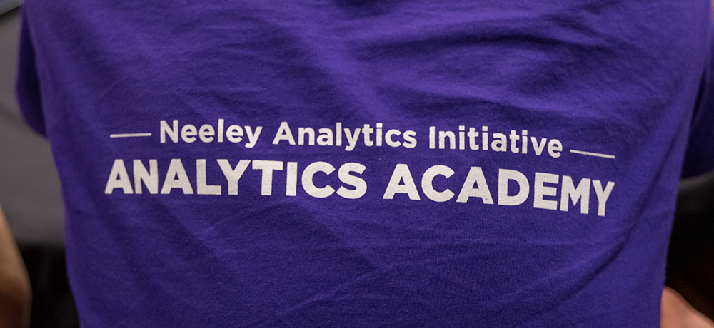 Section Image: Analytics Academy students display their certificates. 