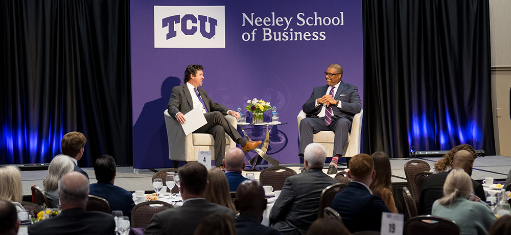 Dean Pullin and Ken Bouyer on the stage at the Tandy Executive Speaker Series event.
