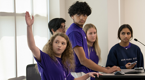 Analytics Academy students display their certificates. 