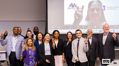 Neeley MBA students with frogs up 