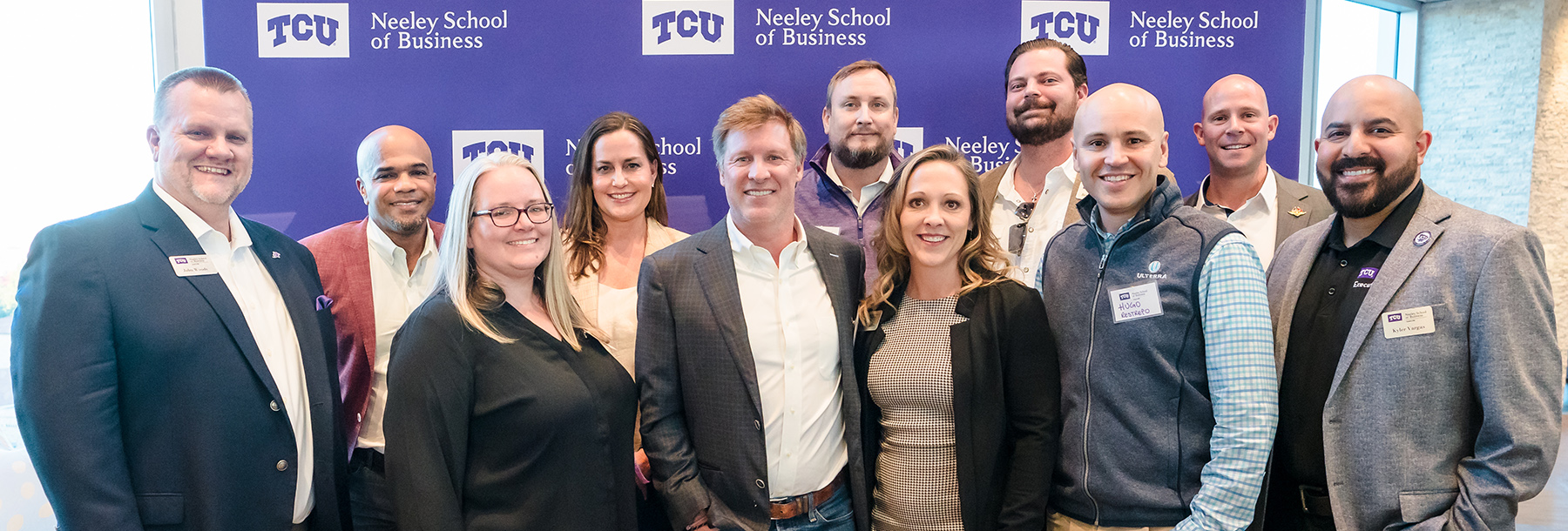 Section Image: EMBA group photo at an event 