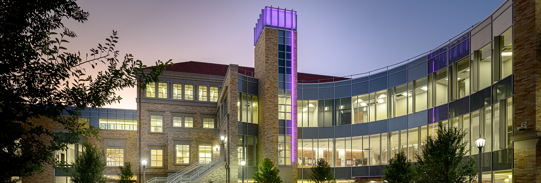 Section Image: Neeley School building at twilight 