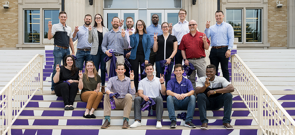 Section Image: Energy MBA students on the steps in front of the TCU Library 