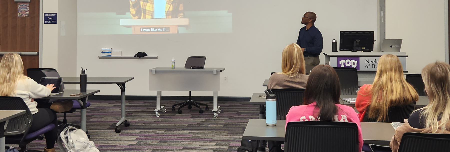 Section Image: Students and Professor Elijah Clark watch Super Bowl ads 