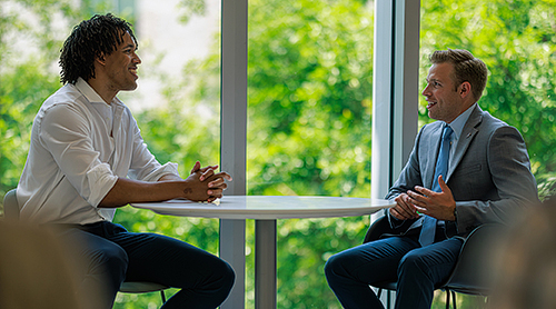 Students sitting at a round table on the second floor of Hays