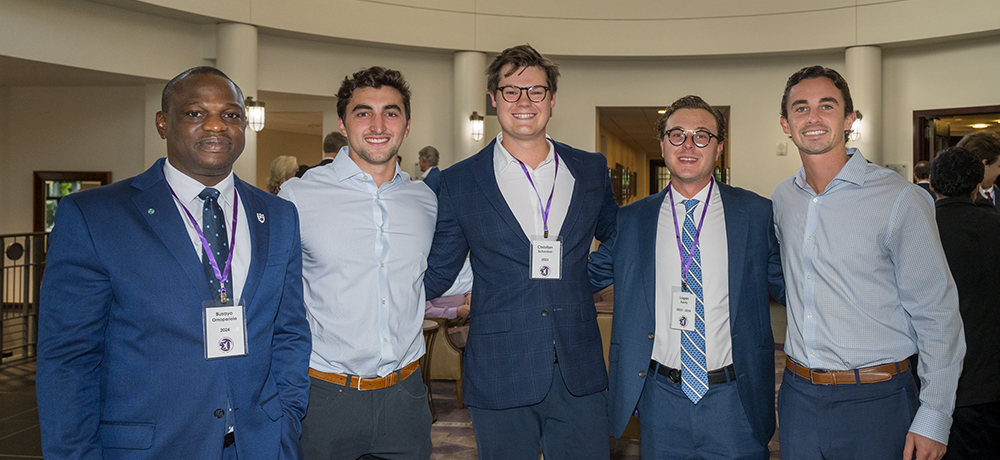 Group in the lobby of the Dee J. Kelly Alumni and Visitors Center