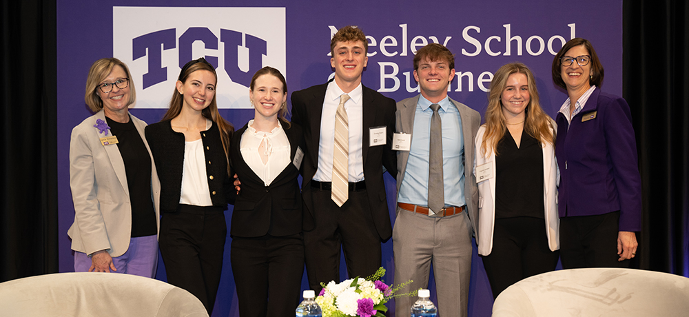 Hettie Richardson, Laura Meade and students on the stage at the TESS event