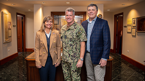 Ann Bluntzer and Energy MBA candidate Pete Baldwin with Admiral Samuel Paparo, Commander, U.S. Pacific Fleet, during the institute's trip to deliver findings on the Pacific Islands Energy Initiative. 