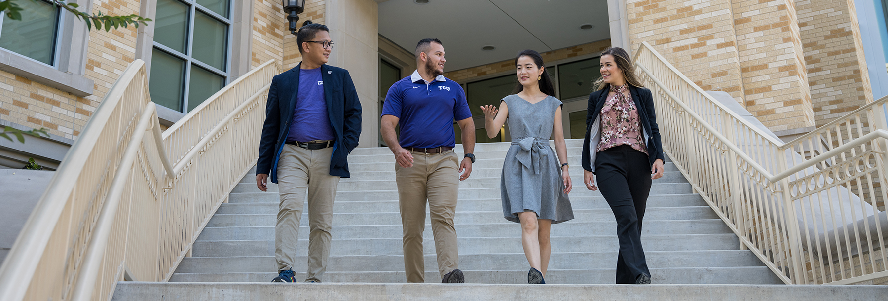 Section Image: Four students on the stairs outside the Neeley Business Commons 