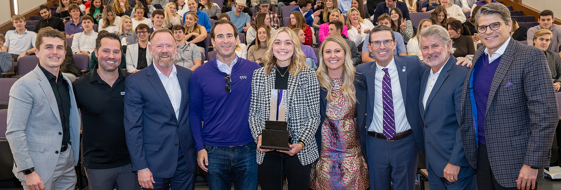 Section Image: Sales Center students and faculty holding trophies. 