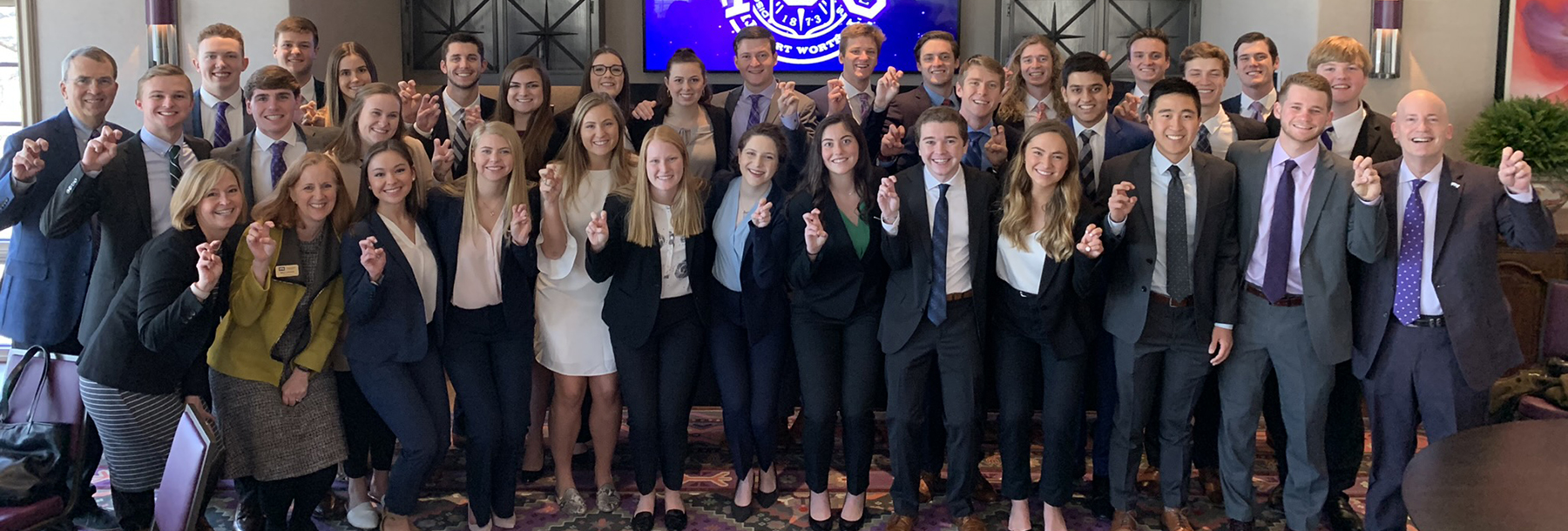 Section Image: Faculty and students sitting at tables in the Smith atrium. 