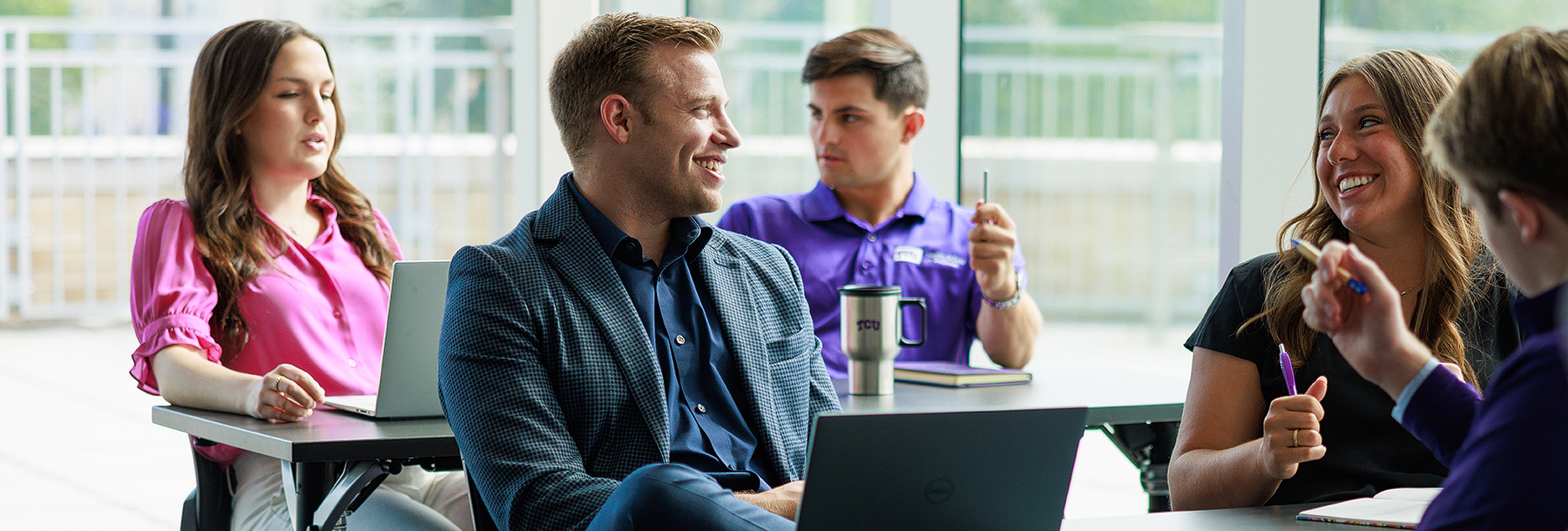 Section Image: students in a classroom discussion 