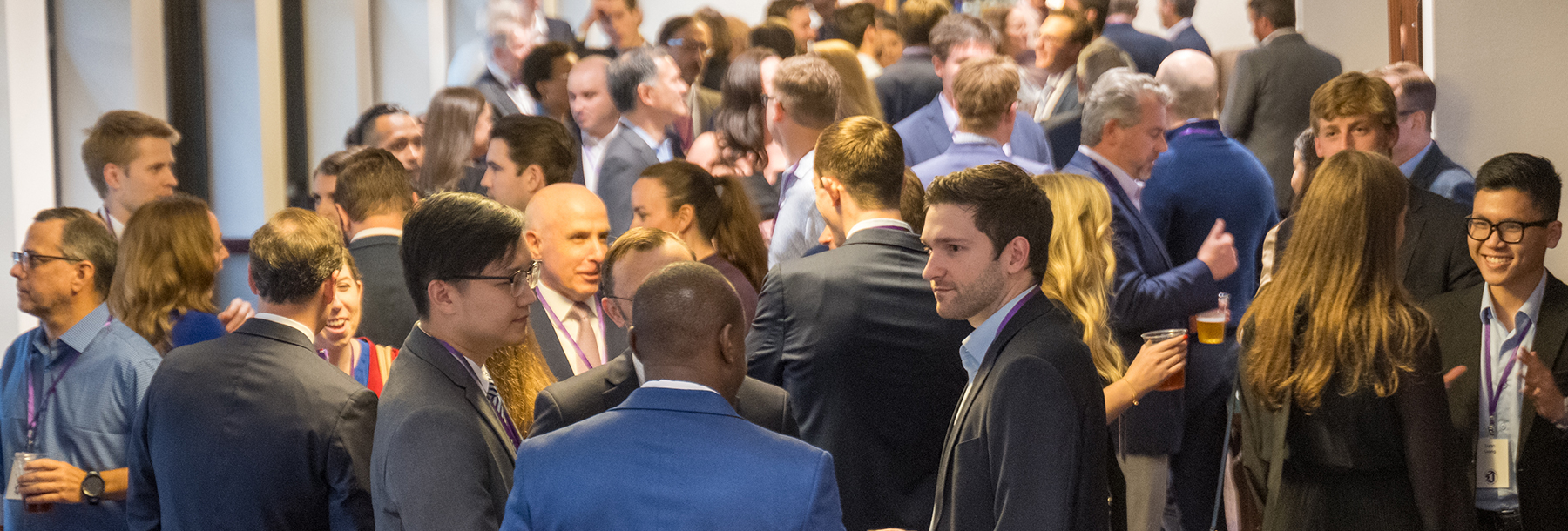 Section Image: EIF 50th Anniversary attendees gather in the lobby of the Dee J. Kelly Alumni and Visitors Center 