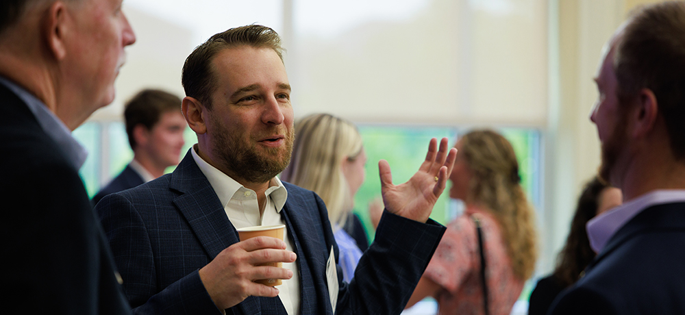 Audience members networking at the TESS breakfast