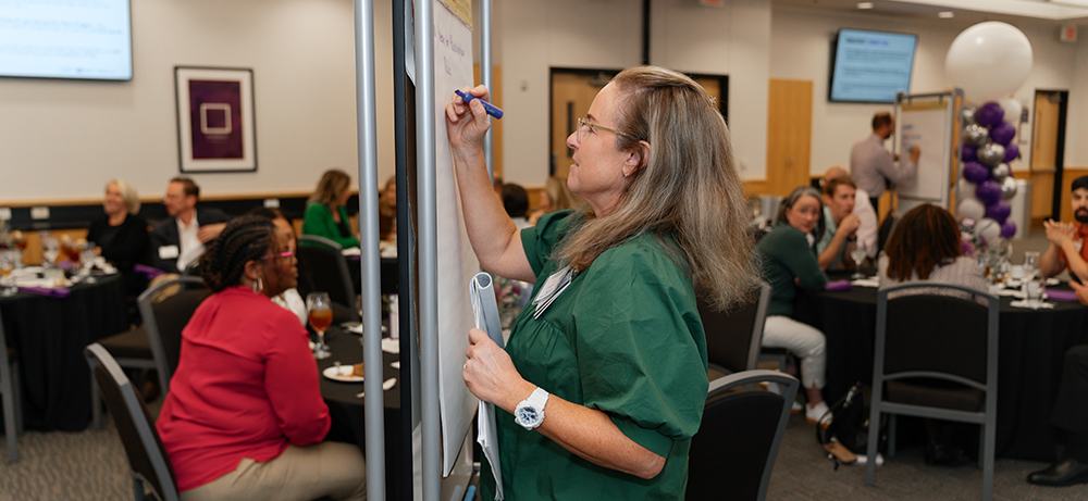 Section Image: Renee Olvera teaching in a classroom 