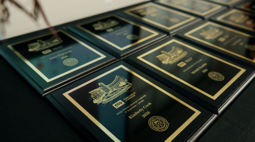 Neeley awards audience members clapping for award recipient 