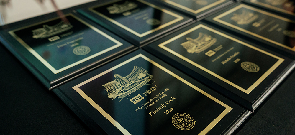 Section Image: Neeley awards audience members clapping for award recipient 
