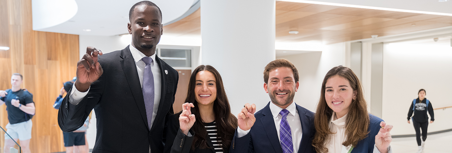 Section Image: Graduate students with their frogs up 