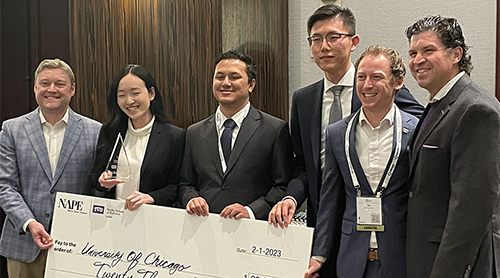 Section Image: Third place team from SMU display their trophy and award check alongside Jason Maloy and TCU President Daniel Pullin 