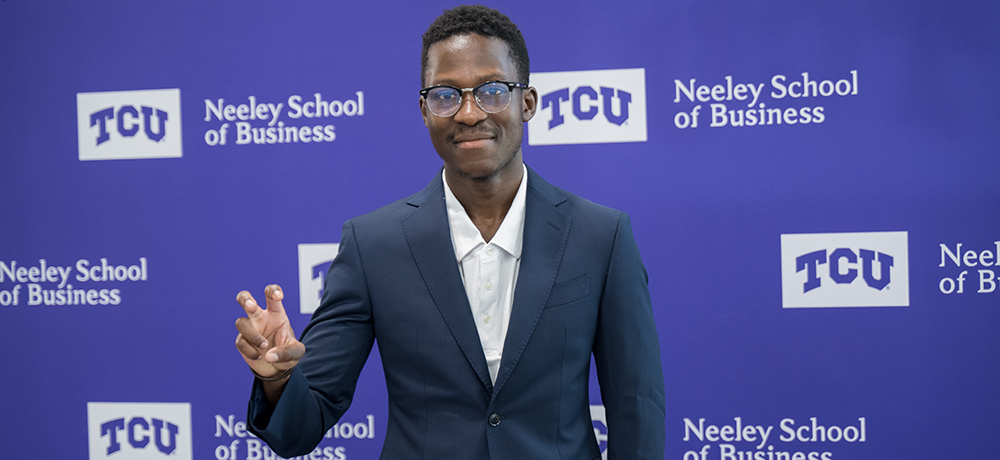 Student showing his suit