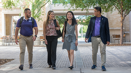 Section Image: Four students on the stairs outside the Neeley Business Commons 