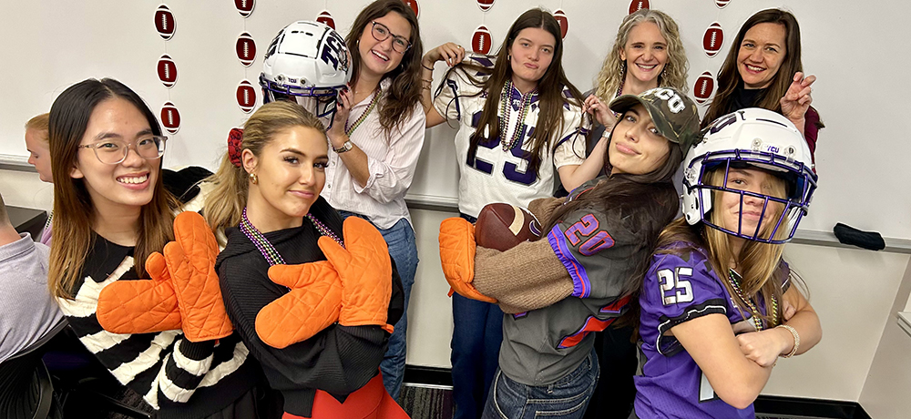 Section Image: TCU students with helmets and mitts 