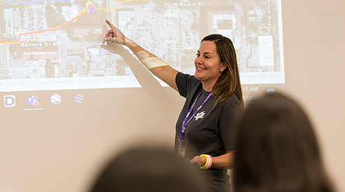 Molly Kanthack pointing to map on screen.