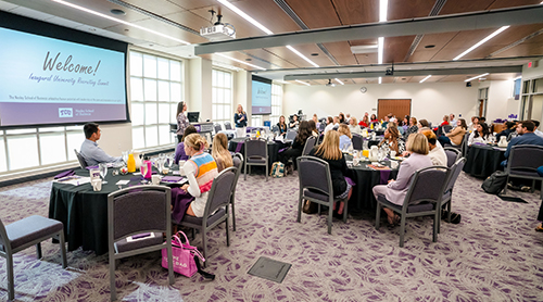 Hays banquet room with people at round tables