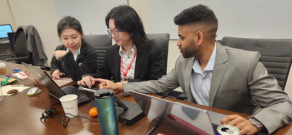 Group of three working in a conference room