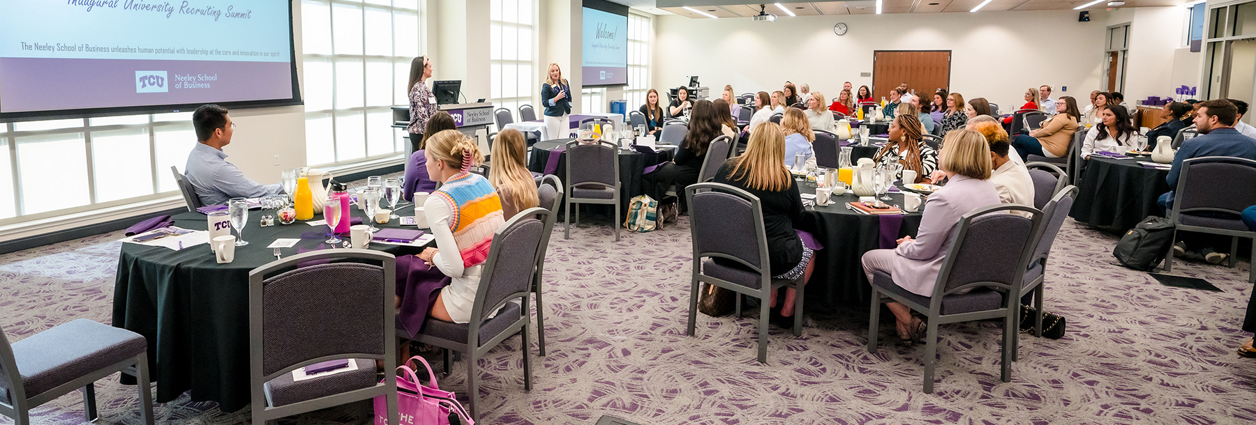 Section Image: Students at round tables in the Hayes banquet room. 