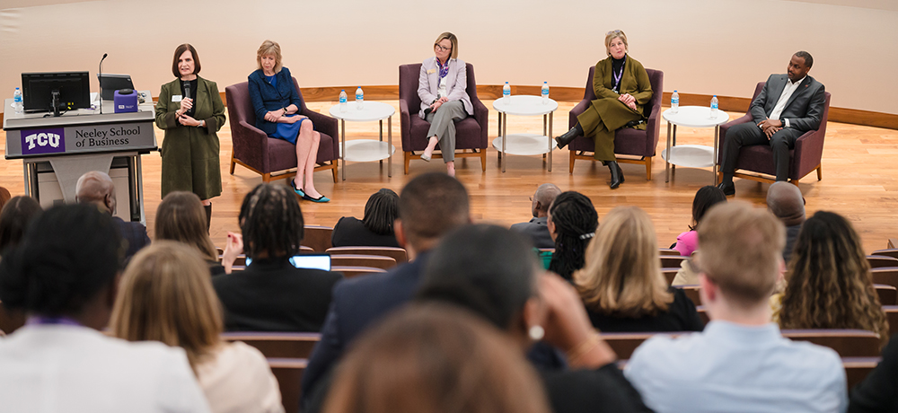 Panelists on the stage in the Shaddock Auditorium