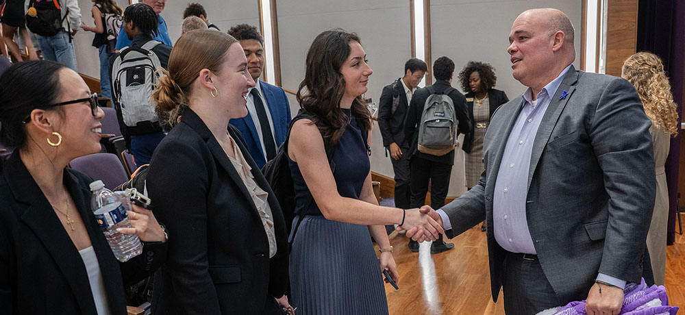 Greg Parsons shaking hands with audience members