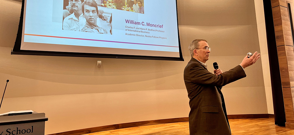 Bill Moncrief in Shaddock Auditorium presenting his lecture on the Past, Present and Future of Neeley